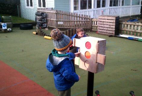 child looking at traffic lights