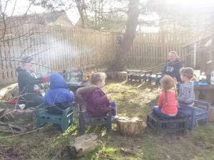 children sitting on logs