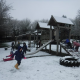 children playing in snowy garden